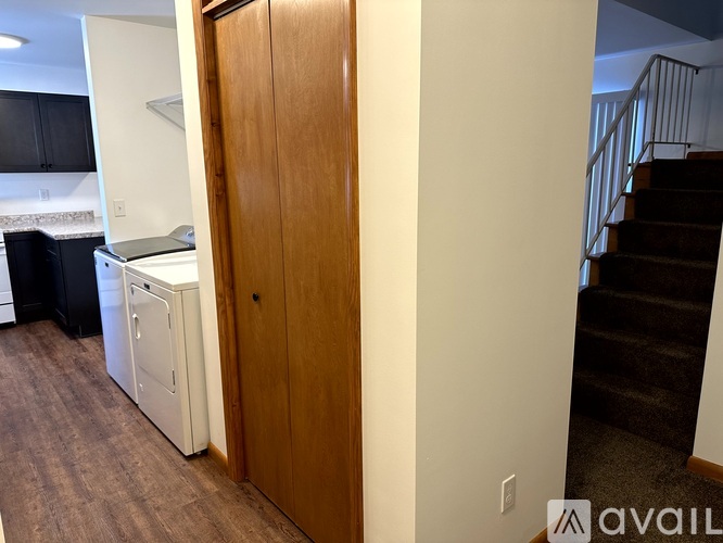 A room with a washer and dryer in it.