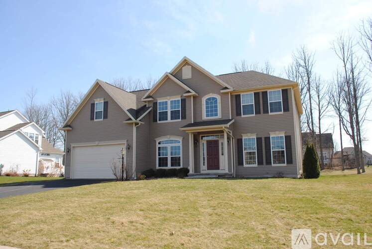 A large house with a garage is available for sale.