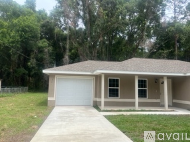 A house with a garage is available for sale.