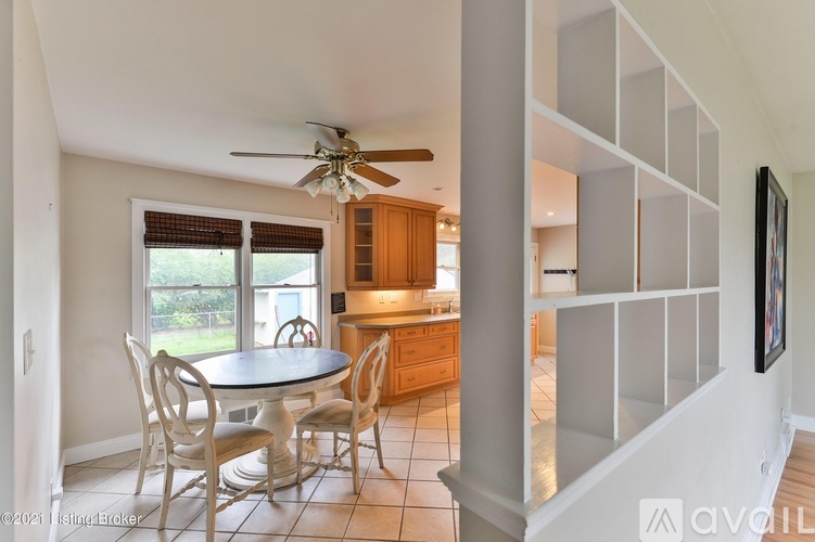 A dining room with a table and chairs is shown.