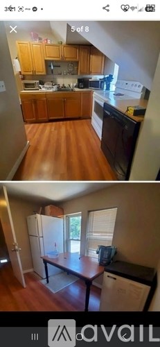 A kitchen with wooden cabinets and a black stove top oven.