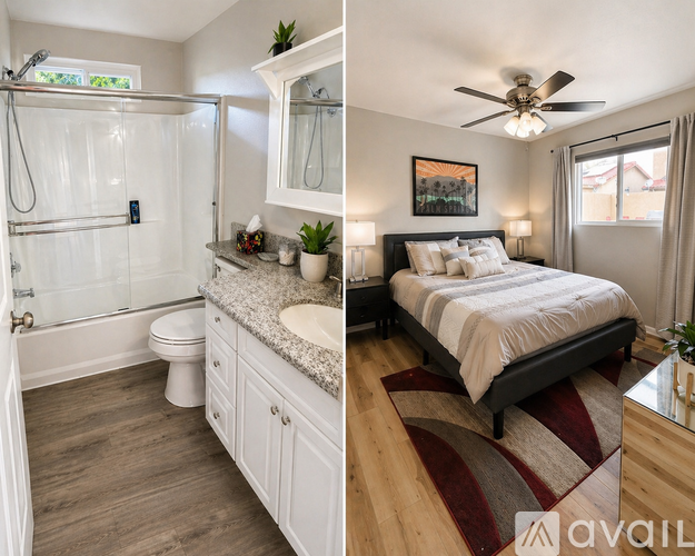 A bathroom with a walk-in shower and a bedroom with a bed and a ceiling fan.