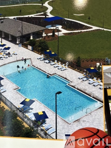 A large swimming pool with a basketball in the foreground.