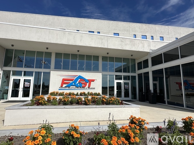 The front of a building with a large glass window and a sign that reads "FAST".
