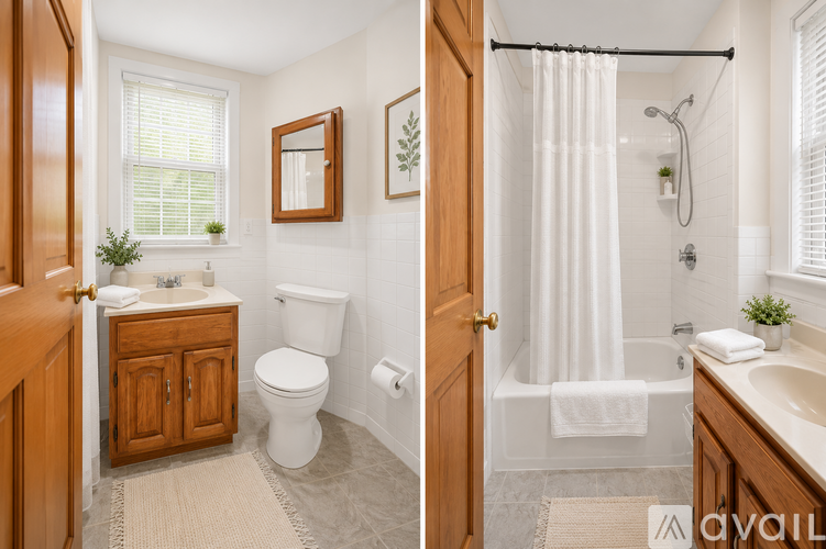 A bathroom with a toilet, sink, and shower.
