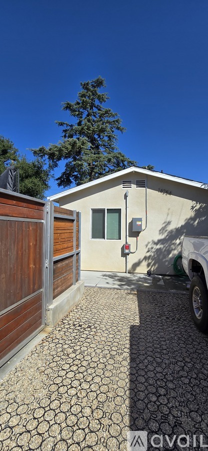 A house with a white truck parked in front.