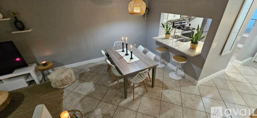 A dining area with a table set for four.