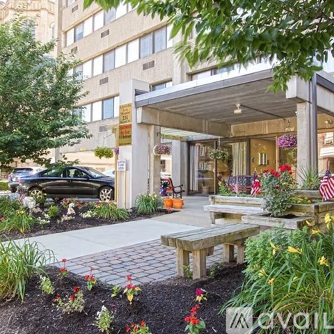 A building with a garden in front of it.