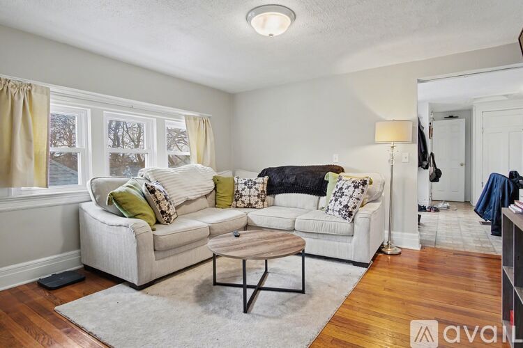 A living room with a white couch and a coffee table.