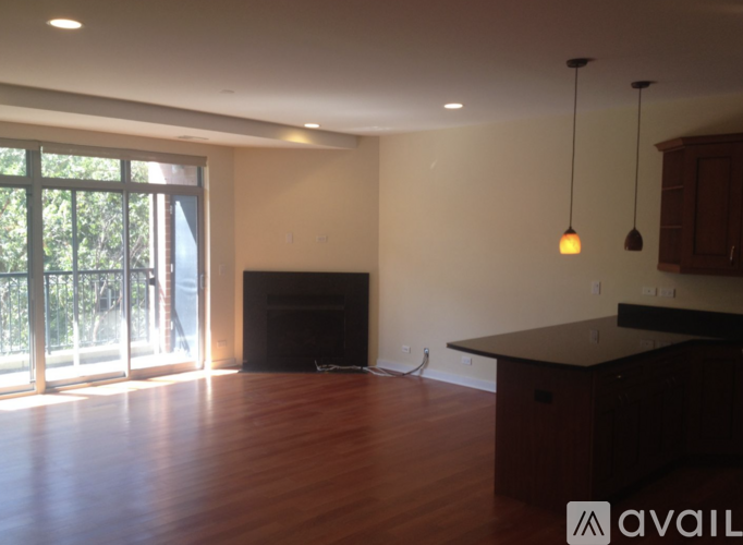 A living room with a fireplace and sliding glass doors.