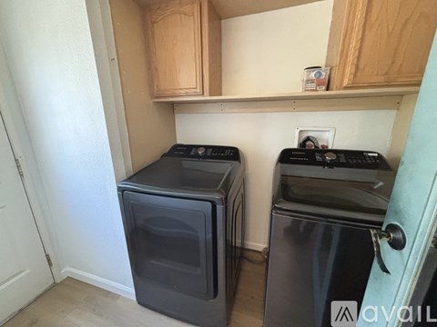 A small kitchen with a black oven and a black dishwasher.