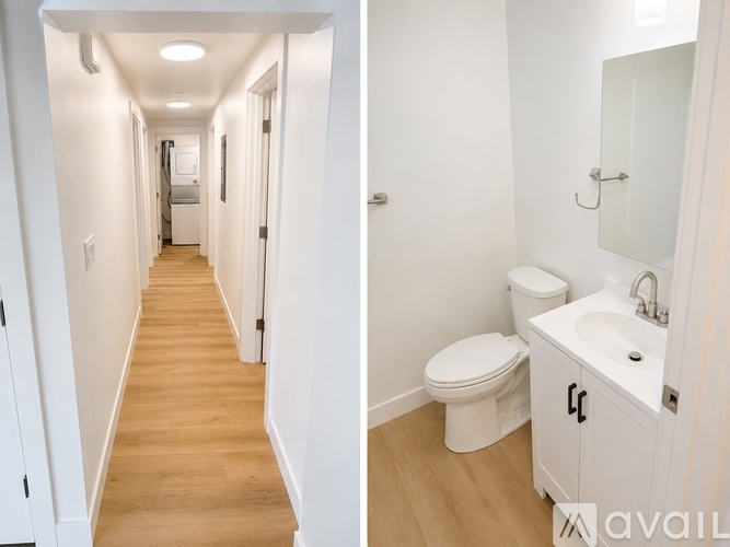 A white bathroom with a toilet and sink.