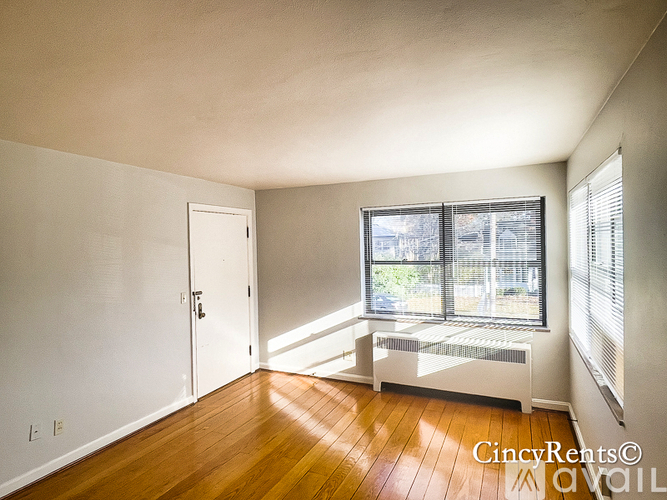 A room with a window and a bench.