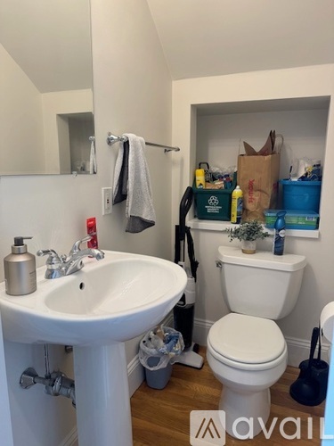 A bathroom with a white toilet and sink.