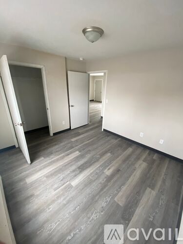 A room with a grey floor and white walls.