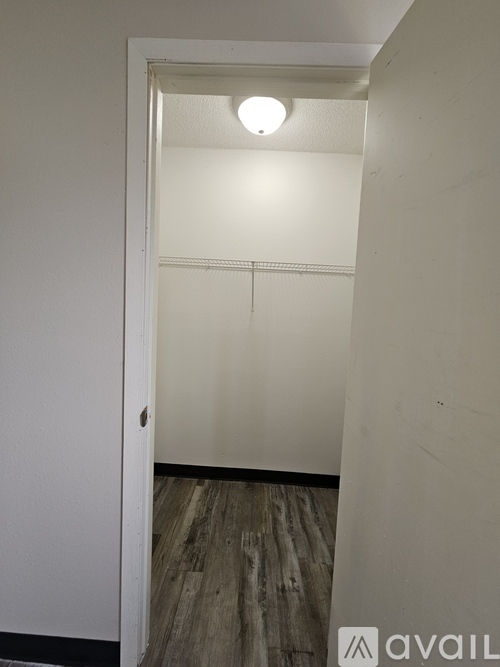 A white door with a hole in the middle.