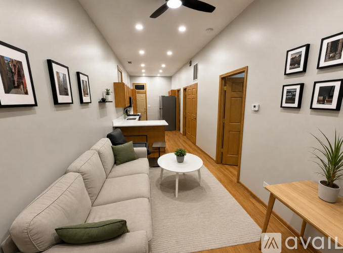 A living room with a white couch and a coffee table.