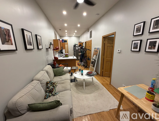 A living room with a grey sofa and a coffee table.
