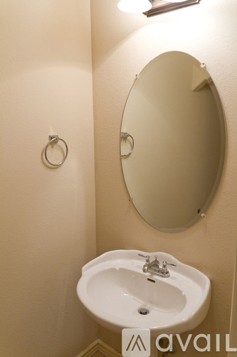 A bathroom sink with a mirror above it.