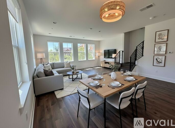 A well-lit dining area with a table set for six.