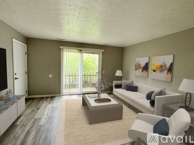 A living room with a grey sofa, a coffee table, and a painting on the wall.
