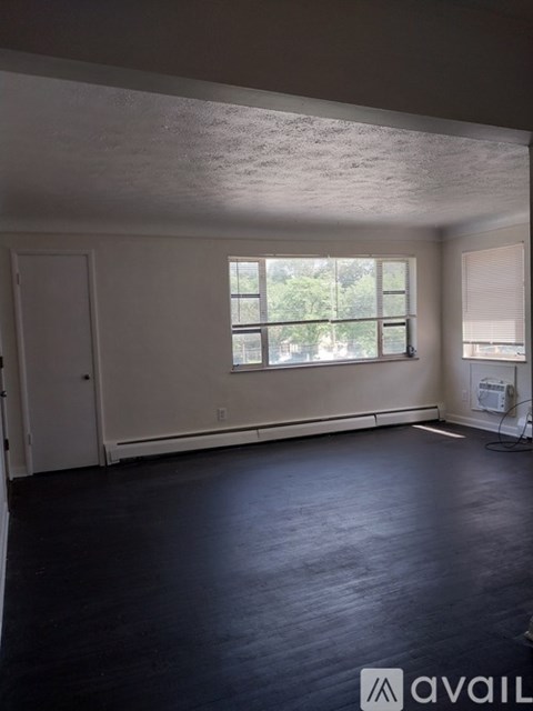 A room with a window and a door.