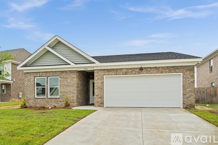 A house with a garage door is for sale.