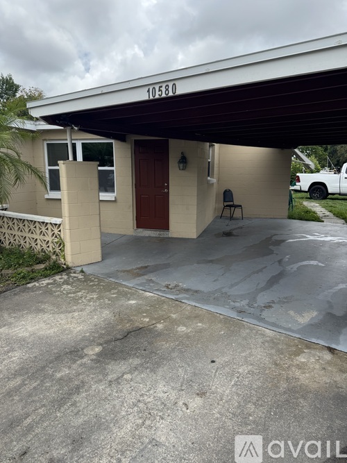 A house with the number 10580 on the garage door.