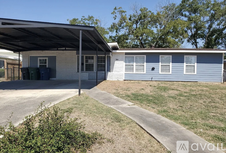 A house with a covered patio and a garage door.