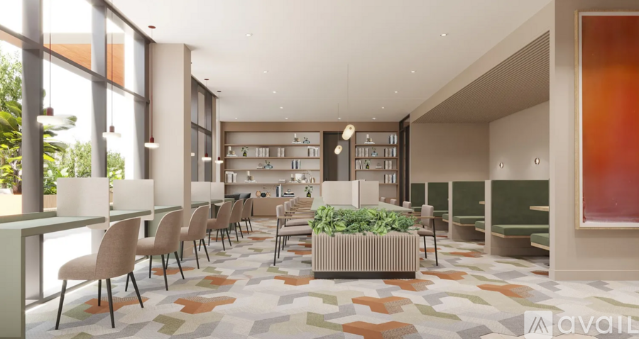 A modern dining area with a long table and chairs.