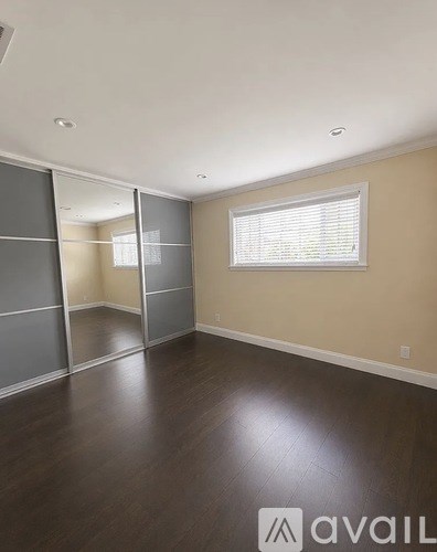 A room with a sliding door and a window.