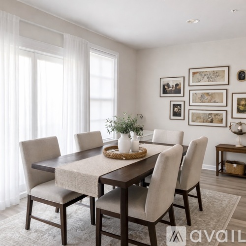 A dining room with a table set for four.