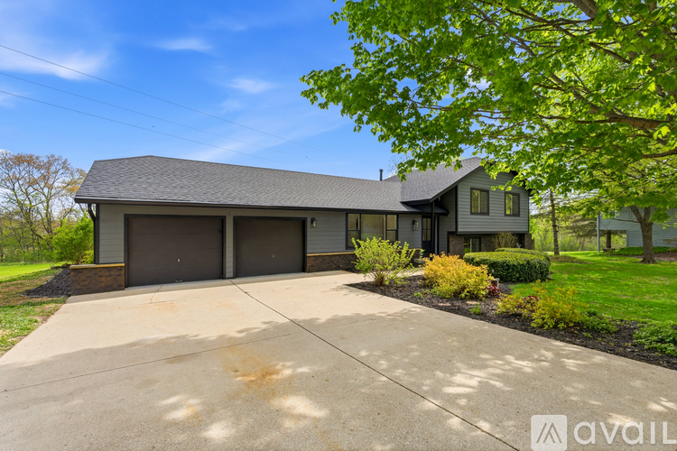 A house with a garage is available for sale.