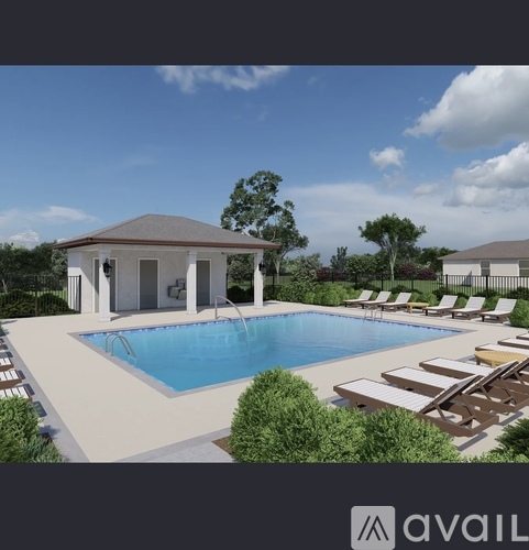 A pool with a pavilion and sun loungers.