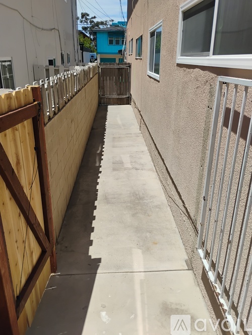 A long concrete walkway between two buildings.