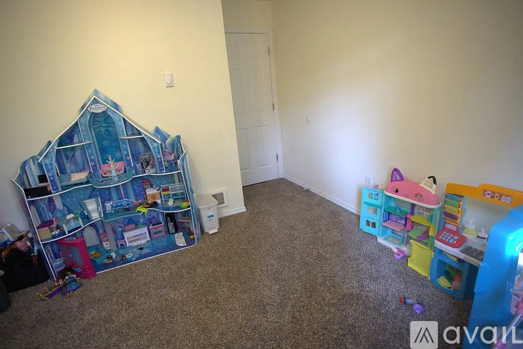 A child's bedroom with a bed, dresser, and toy storage unit.