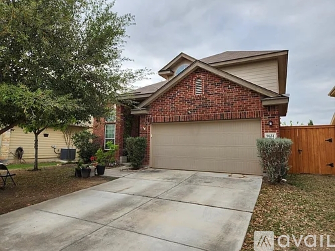 A house with a brick facade and a garage door.