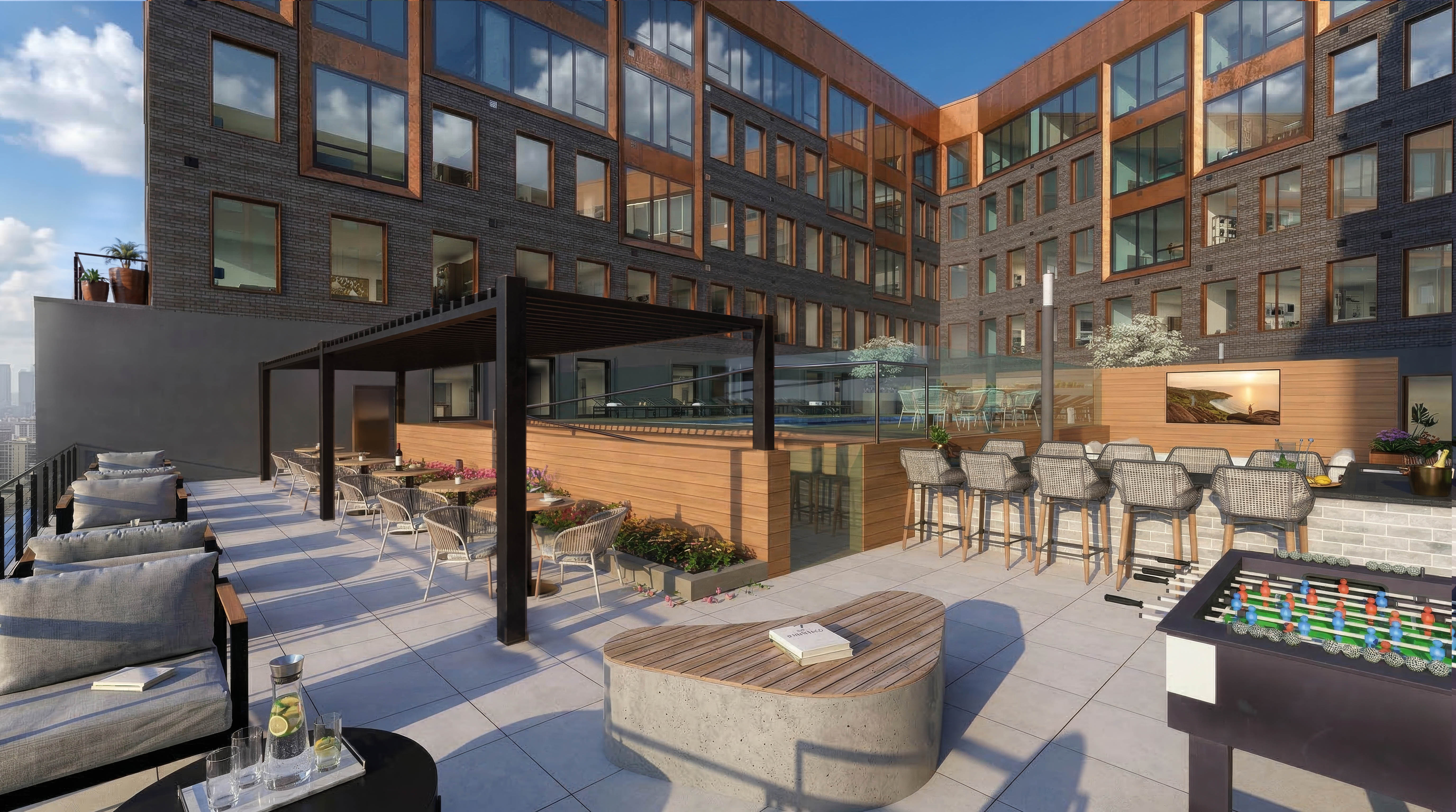 A modern outdoor seating area with a variety of seating options and a pool table.