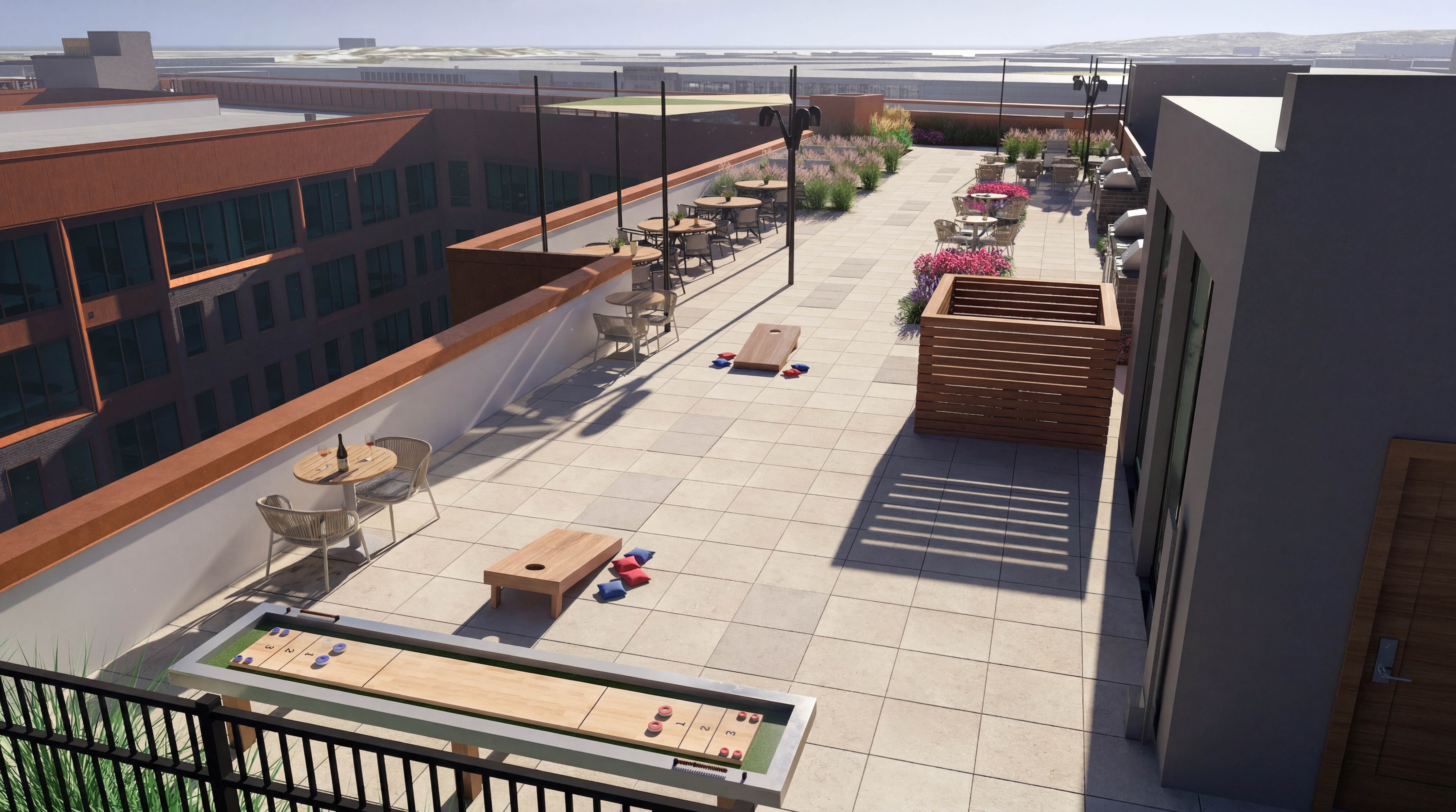 A patio with a table and chairs is surrounded by buildings.
