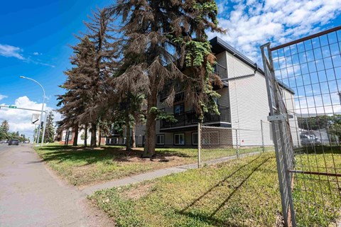 A building with a fence in front of it.