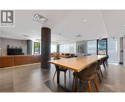A conference room with a long table and chairs.