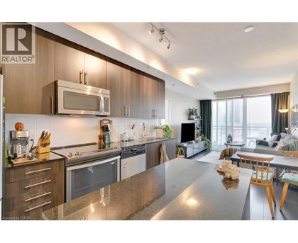 A modern kitchen with wooden cabinets and stainless steel appliances.