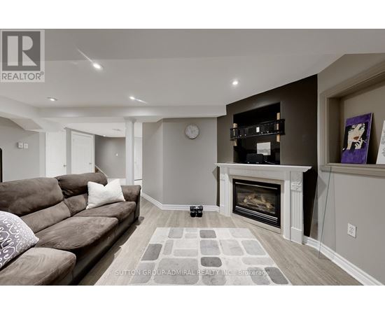 A living room with a fireplace and a couch.