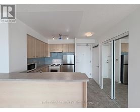 A kitchen with a counter top and cabinets.