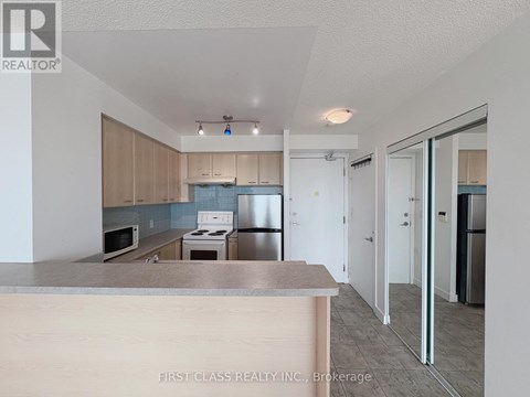 A kitchen with a counter top and cabinets.