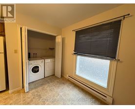 A laundry room with a washer and dryer in it.
