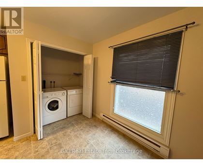 A laundry room with a washer and dryer in it.