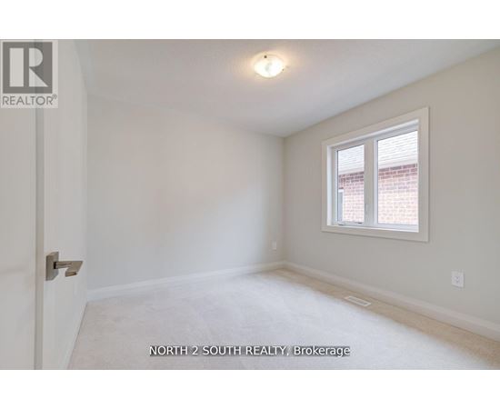 A room with a window and a door.