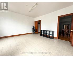 A room with white walls and a tiled floor.