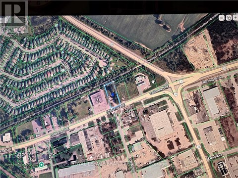 A satellite image shows a residential area with streets and houses.
